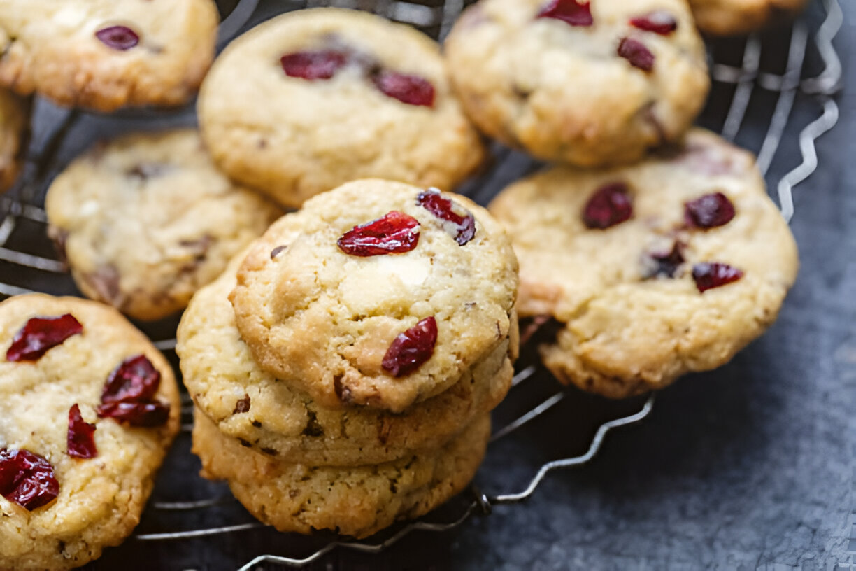 Freshly baked cookies with cranberries on a cooling rack