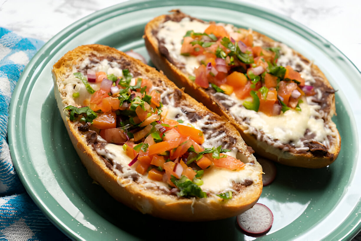 Delicious bread topped with melted cheese, shredded beef, and fresh salsa.