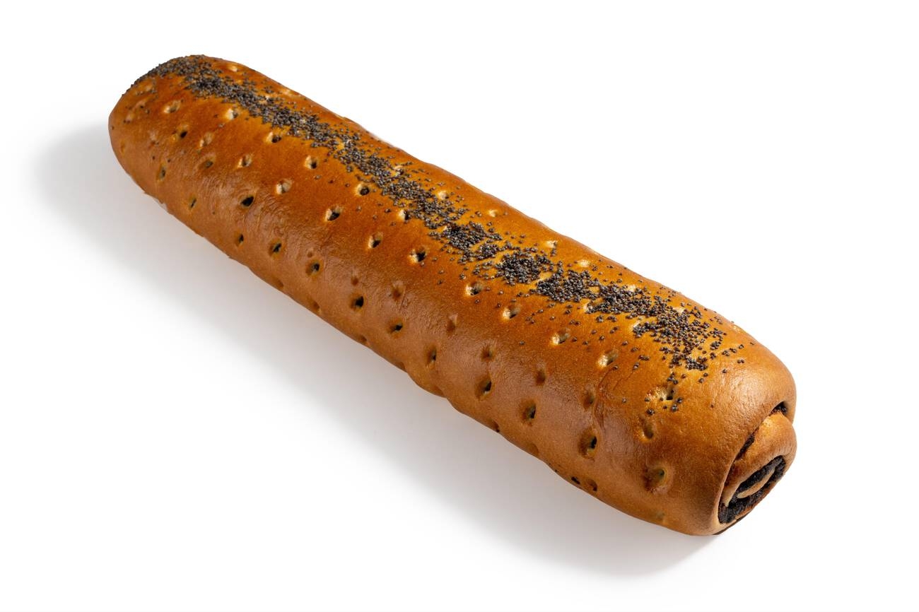 A long, cylindrical bread topped with poppy seeds on a white background.